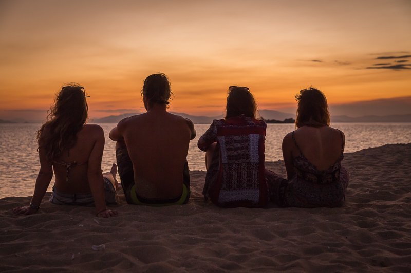 friends looking at a sunset over the whitsunday islands